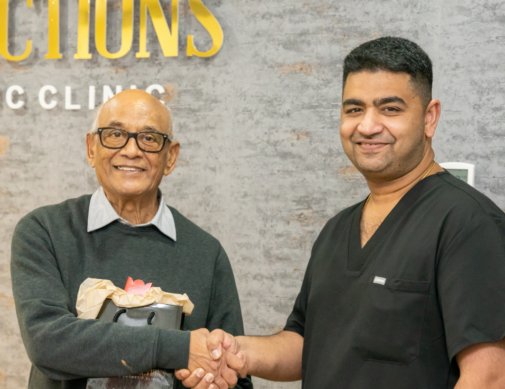 Dr Juttes Pallipatt greeting a happy patient at Smile Perfections in Oadby