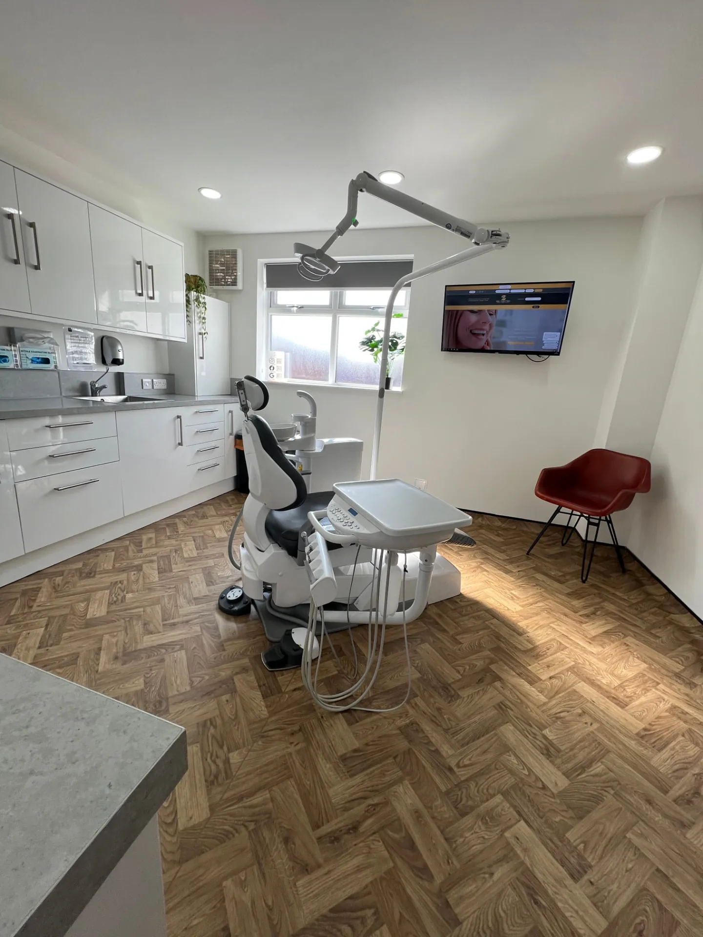 A treatment room at Smile Perfections with a dental chair